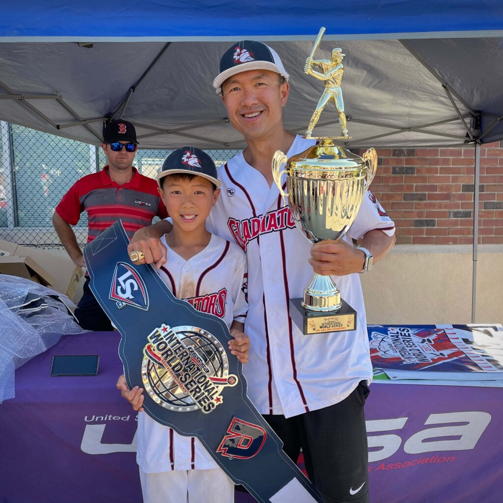 Father and son w travel baseball trophy and belt won at USSSA 2021 Int'l World Series