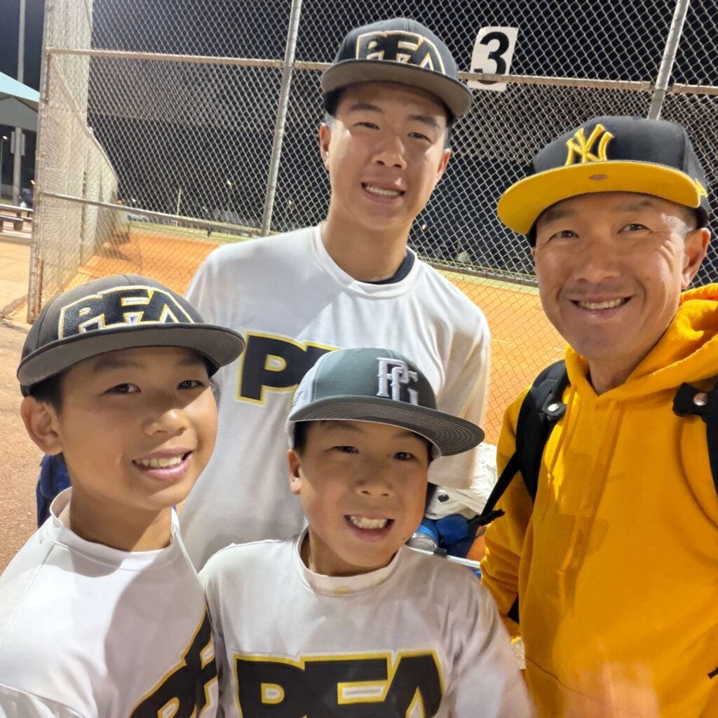 Simon Chan and his 3 boys with huge smiles
