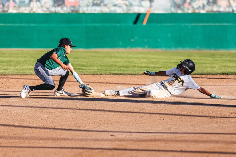 Photo of travel baseball player sliding into second base