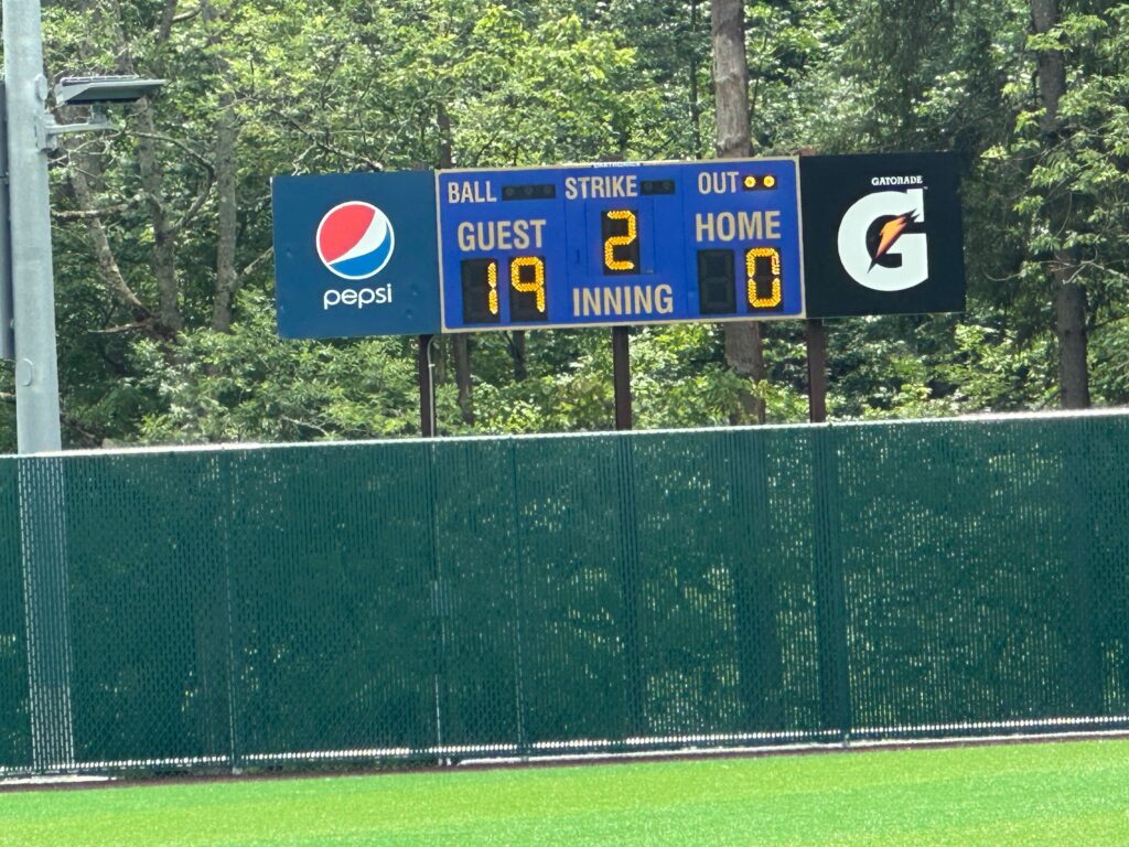 Scoreboard showing 19-0 score in the second inning at Cooperstown tournament