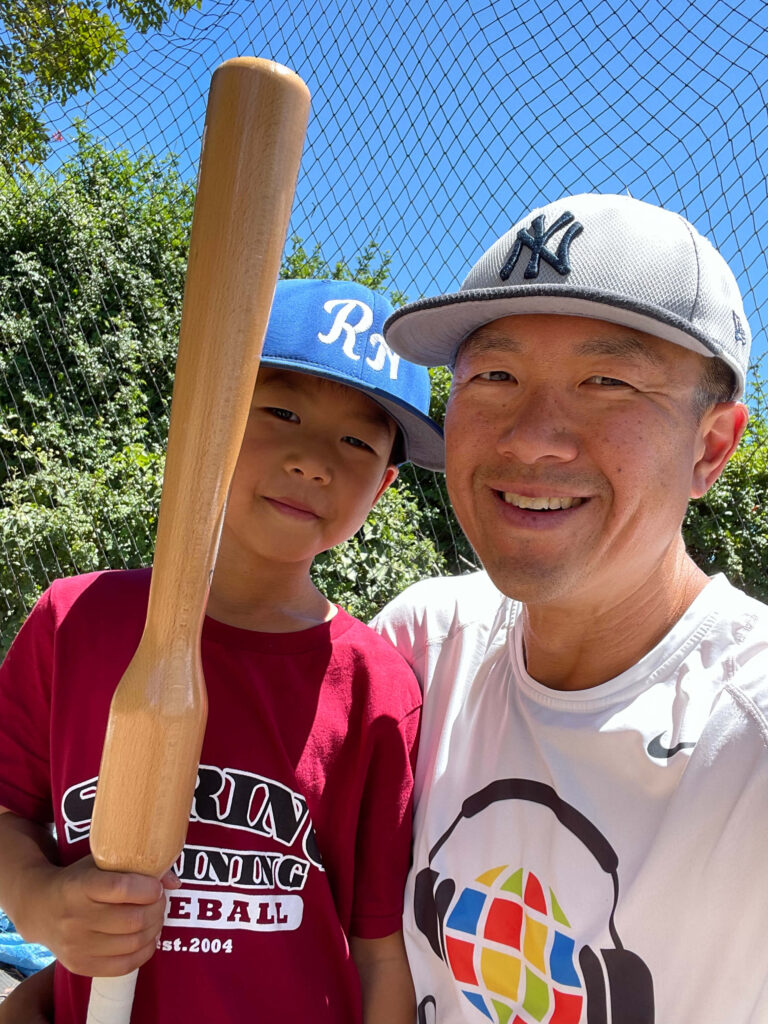 Simon and his middle son holding a Camwood training bat.