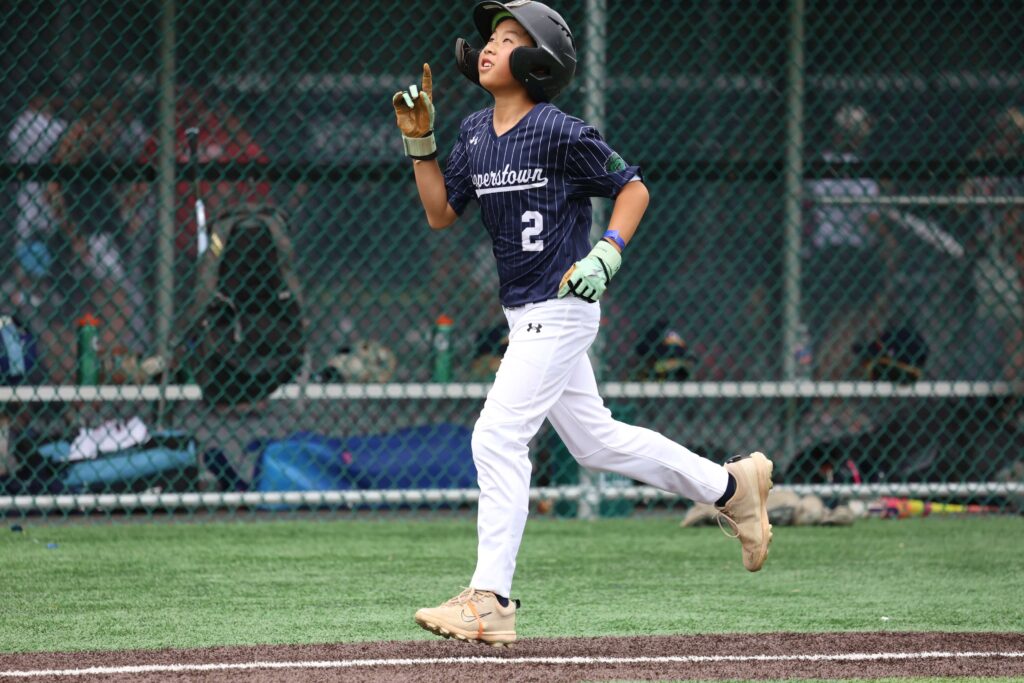 Brendan Chan looking up during home run trot