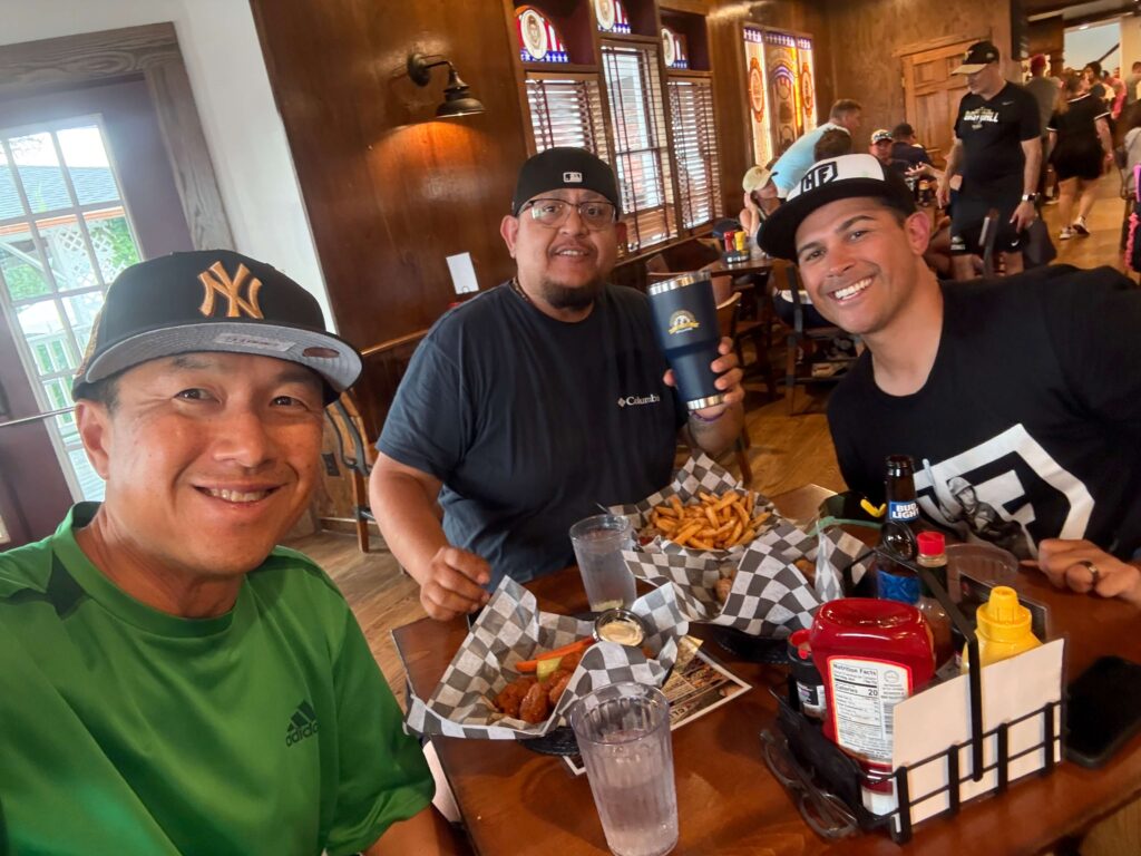Selfie of Simon Chan and 2 friends inside The Clubhouse restaurant at Cooperstown All Star Village