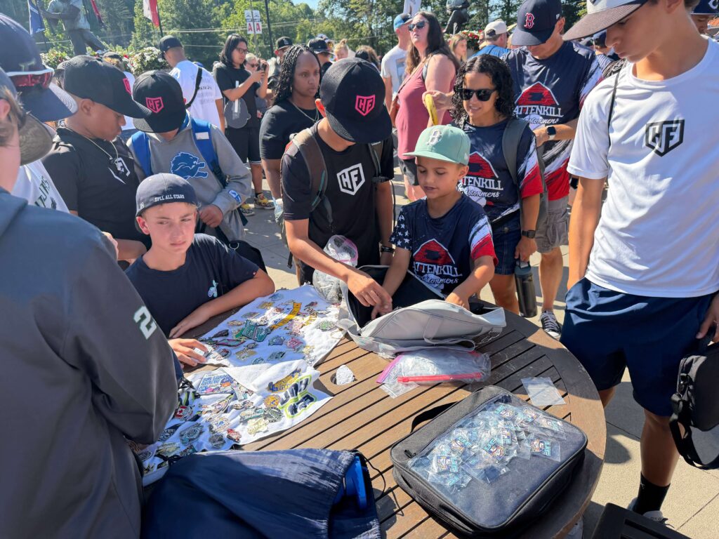 kids trading pins on a table