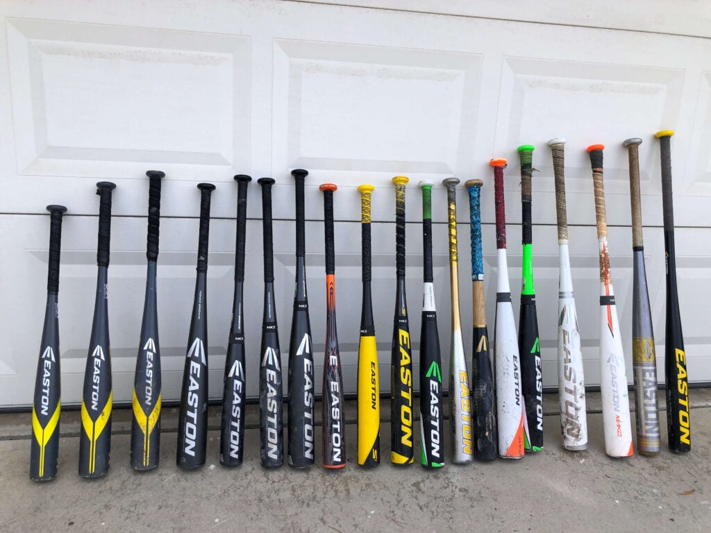 Lineup of used youth baseball bats purchased from online marketplaces
