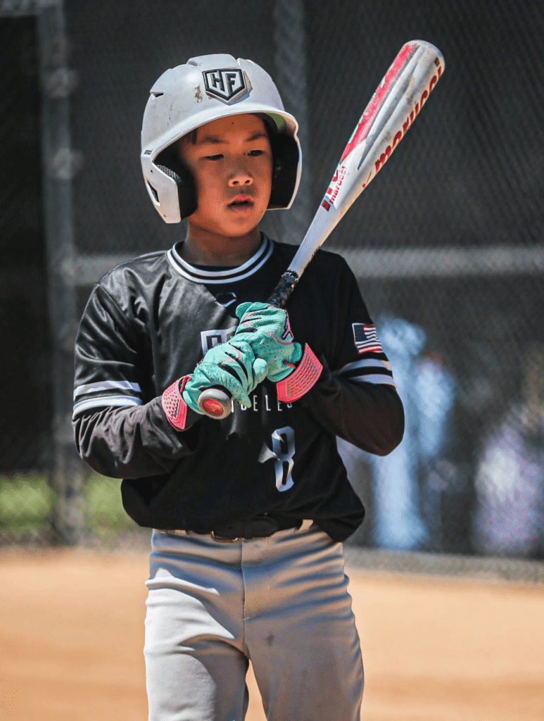 Younger son getting ready to hit with used Marucci CatX alloy bat