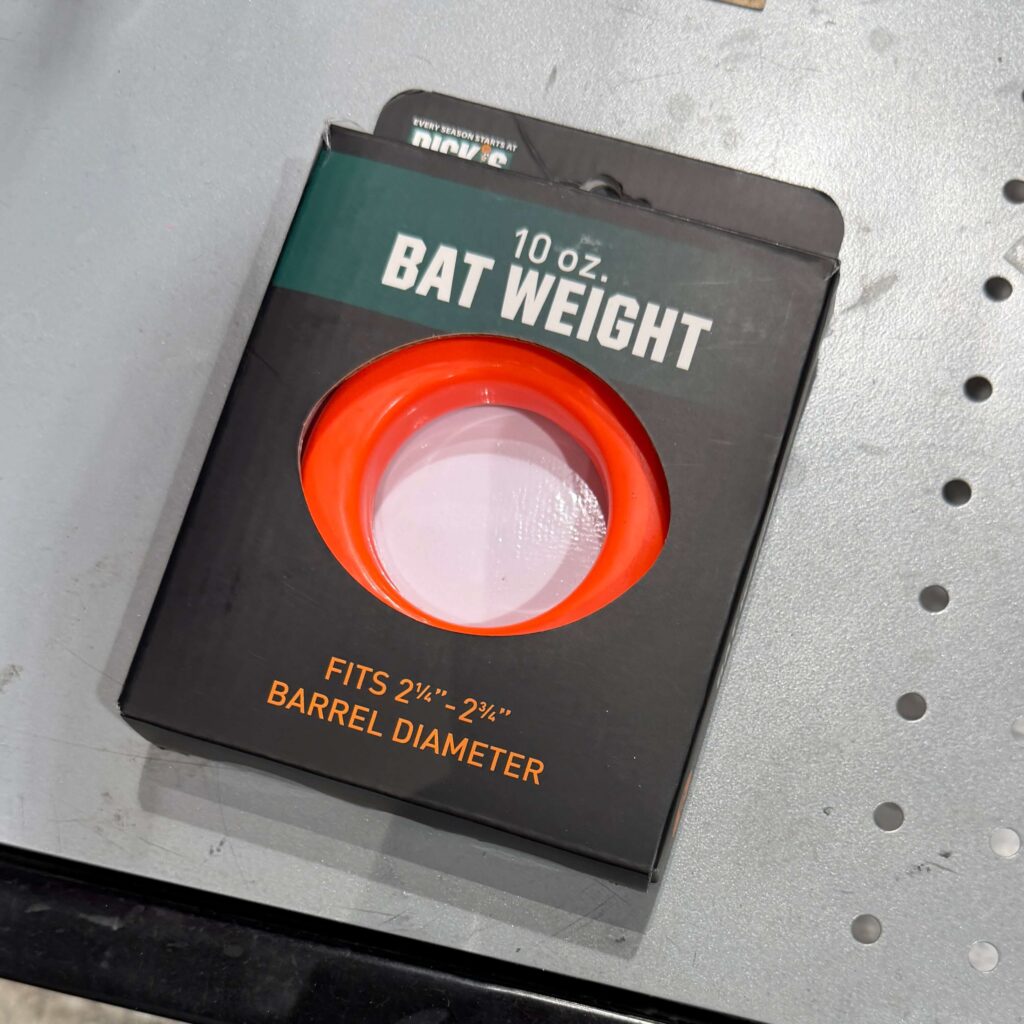 Orange 10 oz. baseball bat donut in Dick's Sporting Goods packaging.