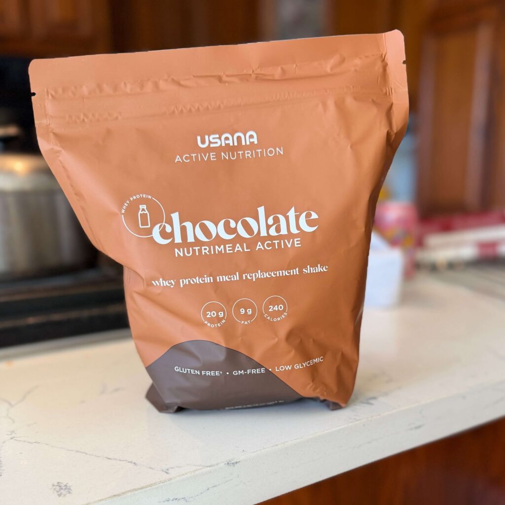 Bag of whey protein meal replacement power made by USANA Health Sciences on top of kitchen counter