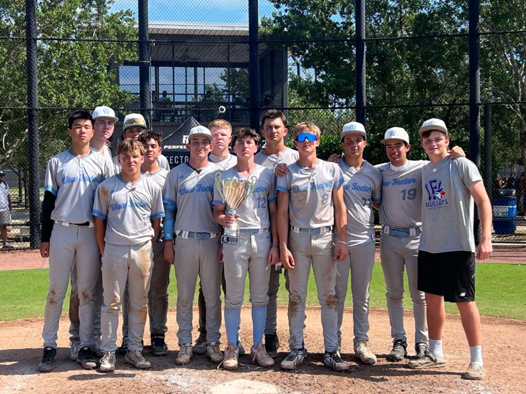 The 15U Wow Factor travel baseball team posing with a Final Four trophy at the 2026 WWBA Freshman World Championship tournament in West Palm Beach, Florida